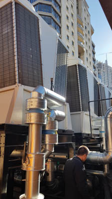 New CHW pumps being installed at roof level below chiller modules. Image credit: RPM Consulting Engineers